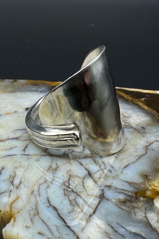 Silver ring with marble background