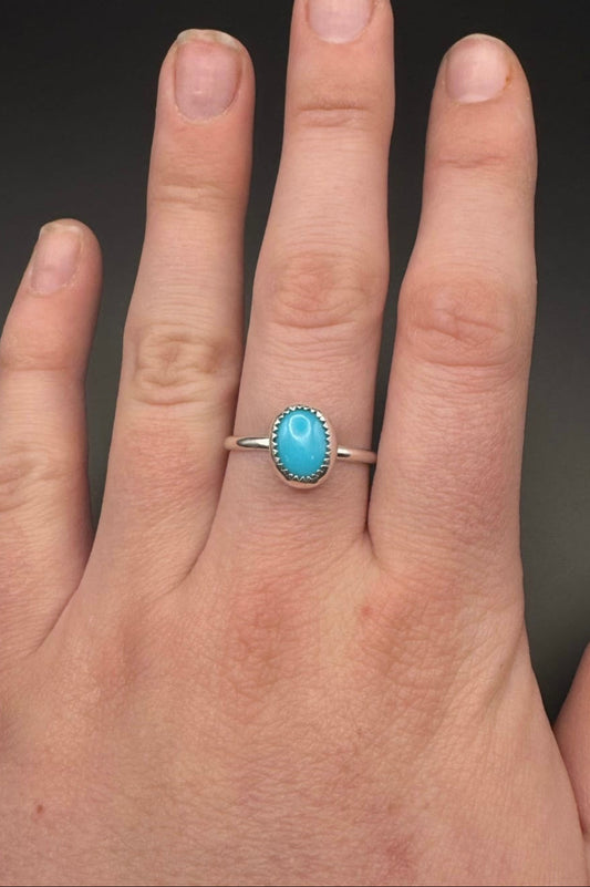 Turquoise ring displayed on hand