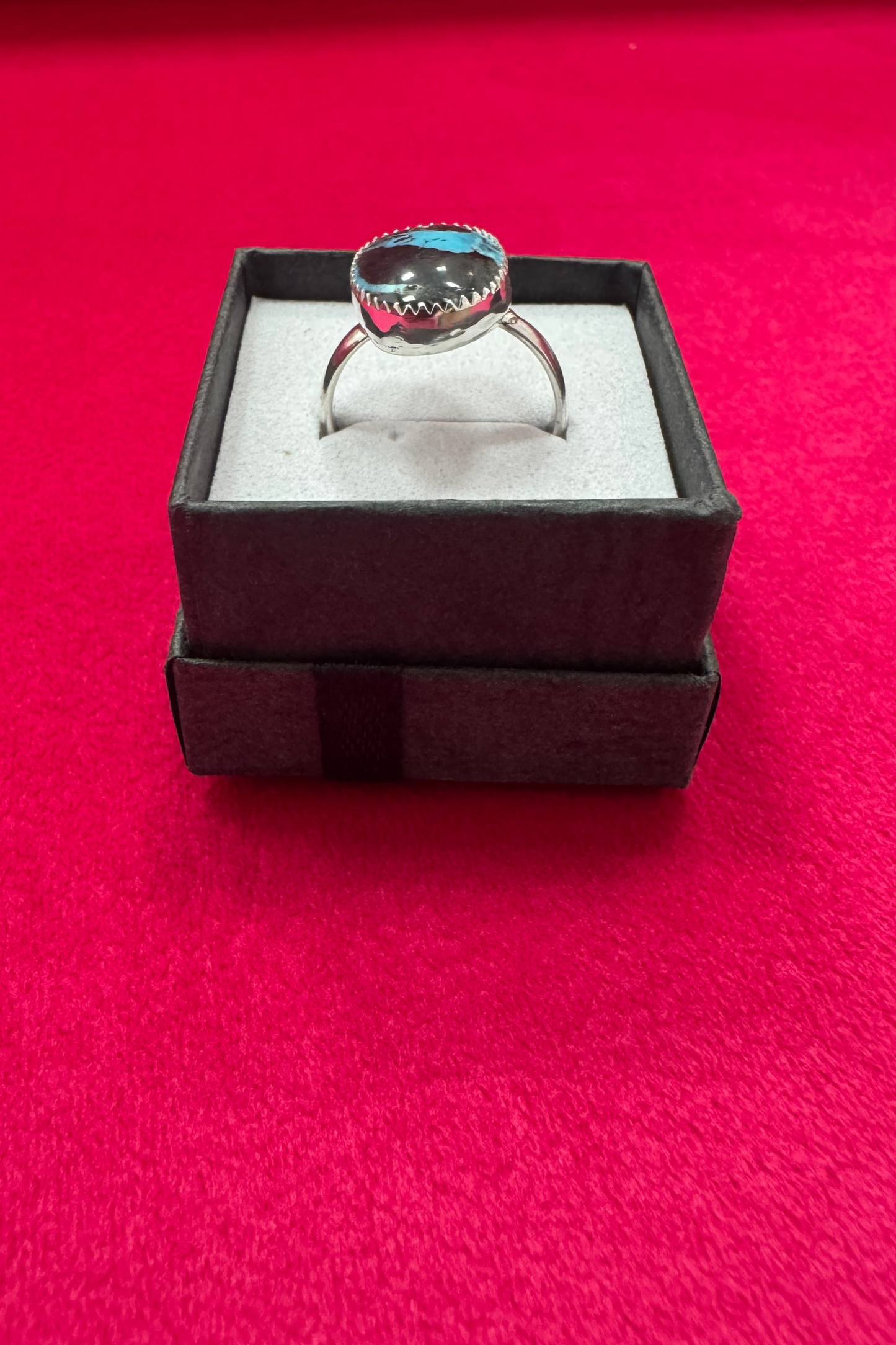 Turquoise ring shown in ring box