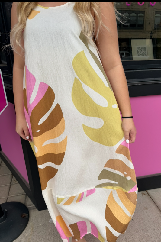 Person wearing a long, patterned dress with a blurred background