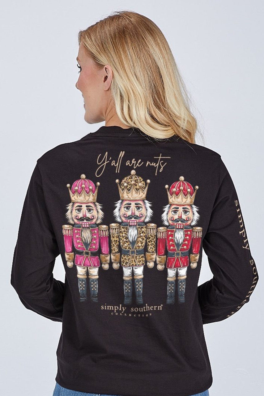 Black long-sleeve shirt with nutcracker design and text on a plain background