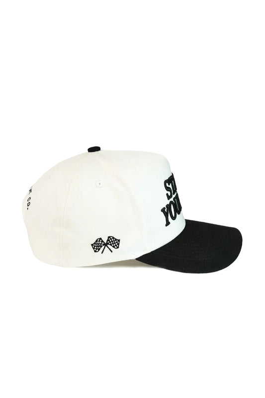 Two-tone cap with white front and black back on a white background