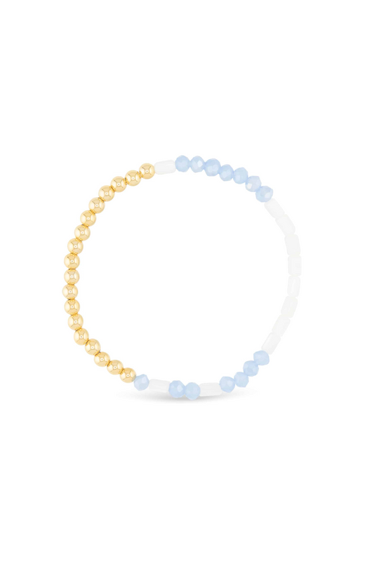 Necklace with gold and blue beads on a white background