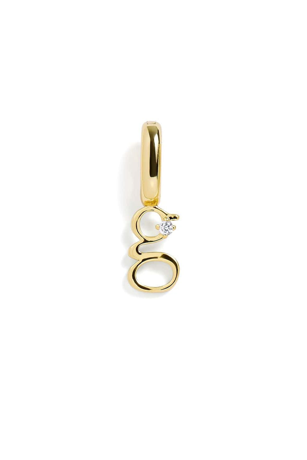 Gold "g" pendant with a small diamond on a white background