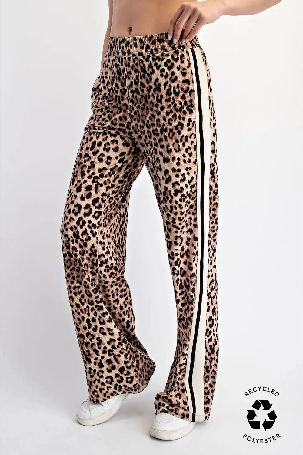 Leopard print pants with side stripes on a white background