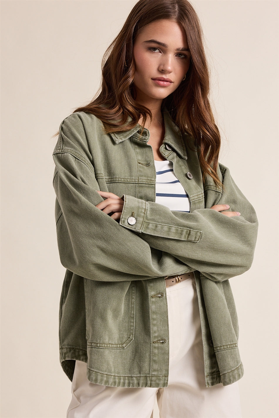 sage green jacket worn by woman