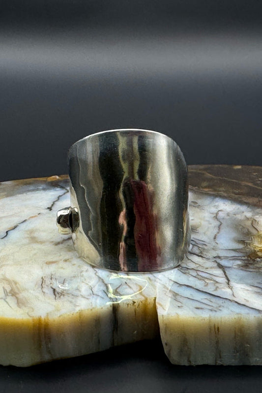 Silver ring with marble background