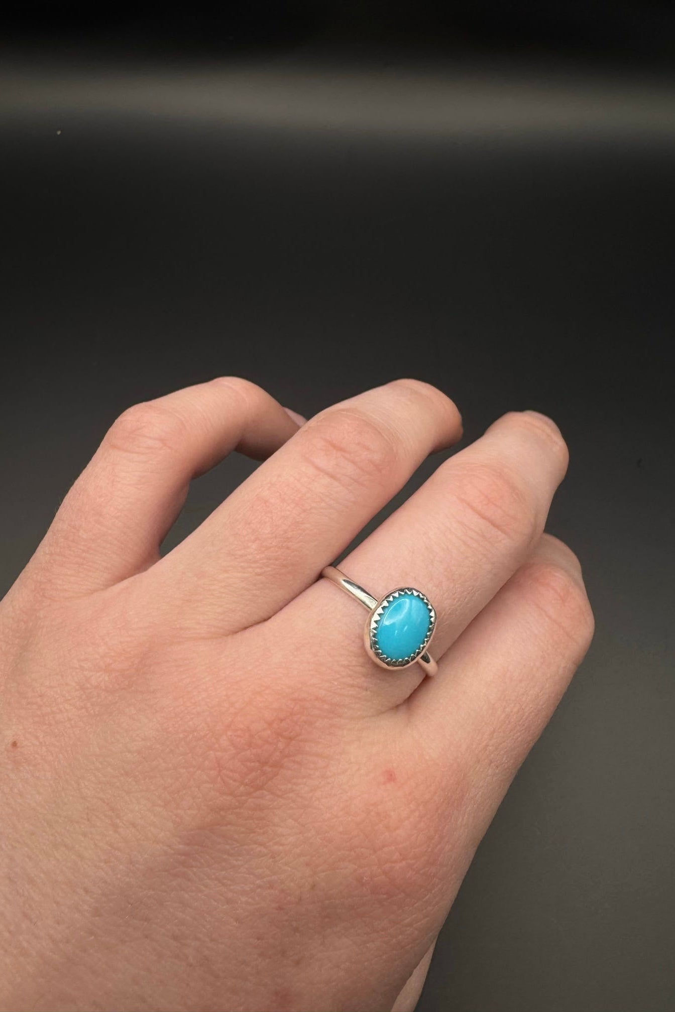 Turquoise ring displayed on hand