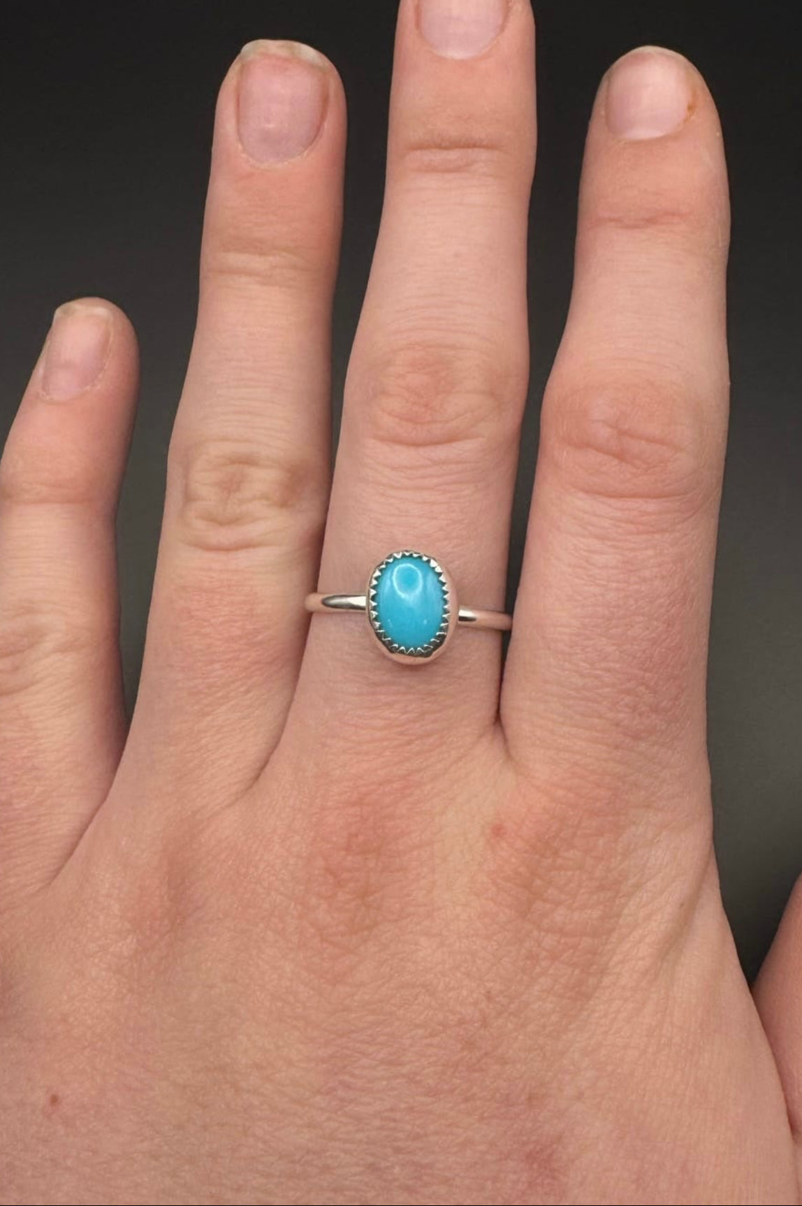 Turquoise ring displayed on hand