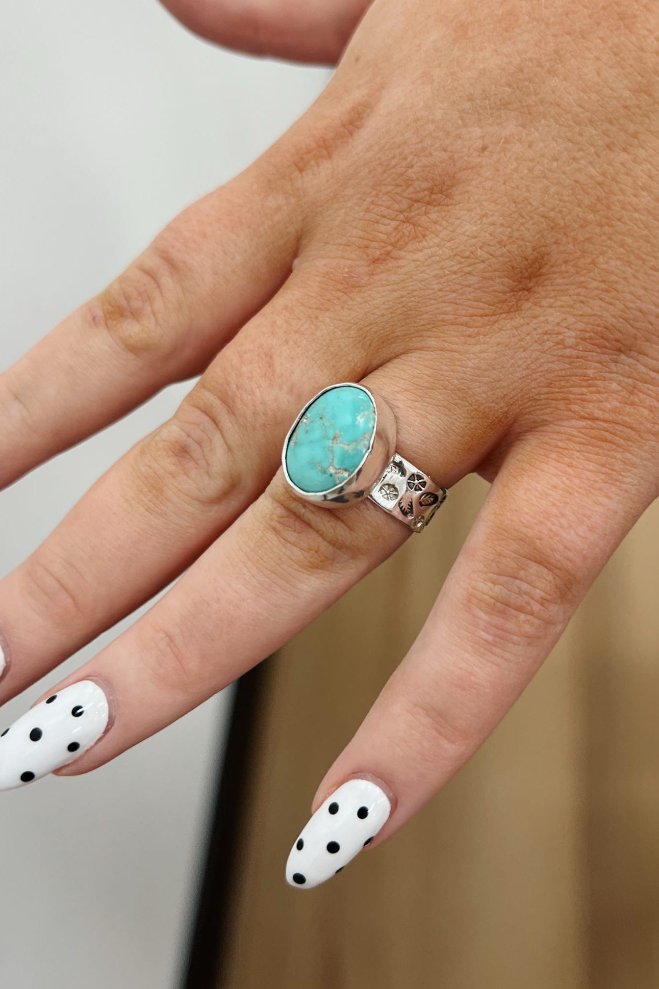 Turquoise ring shown on hand