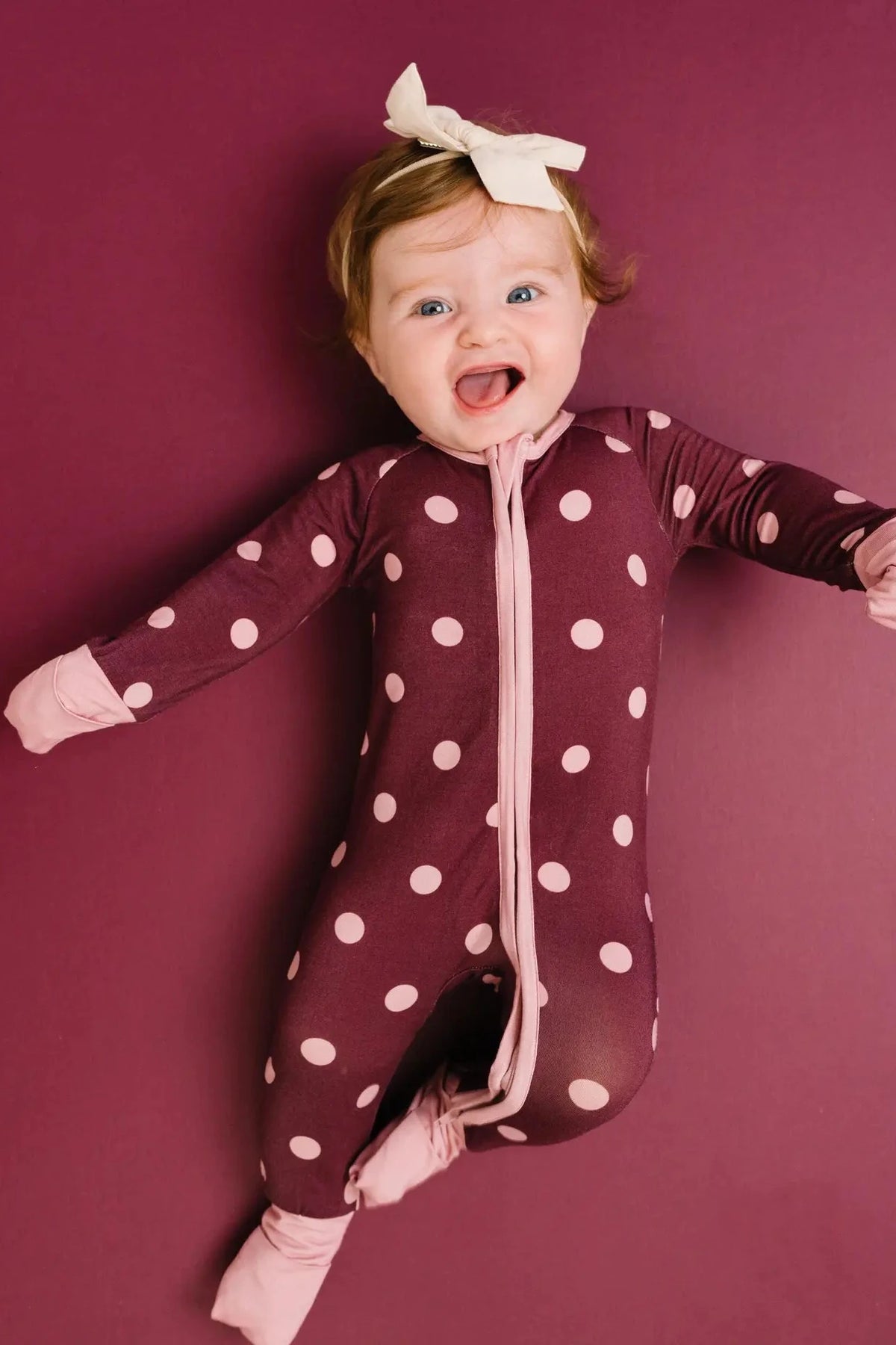 mulberry and pink polka dot onesie