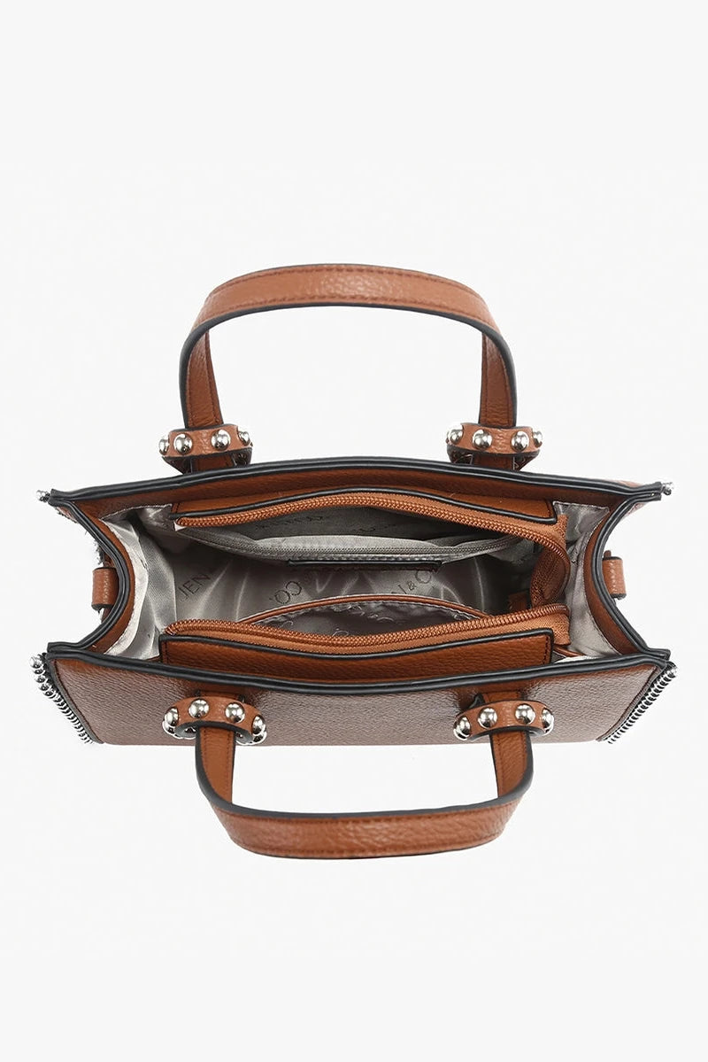 Brown handbag with gold accents on a white background