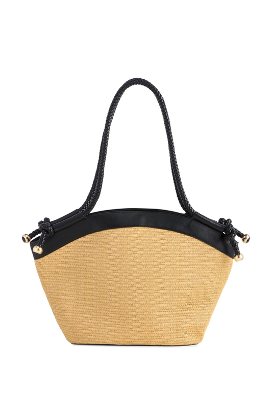 Beige straw handbag with black leather accents on a white background