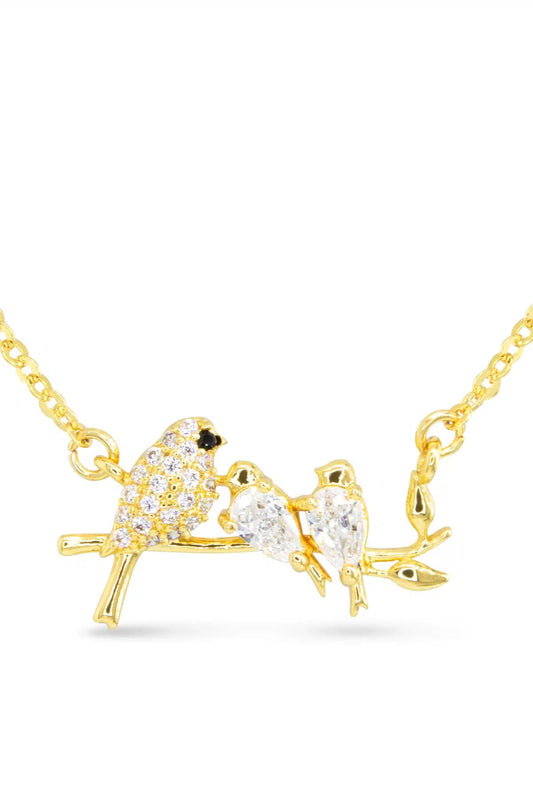 Gold necklace with a bird-shaped pendant on a white background