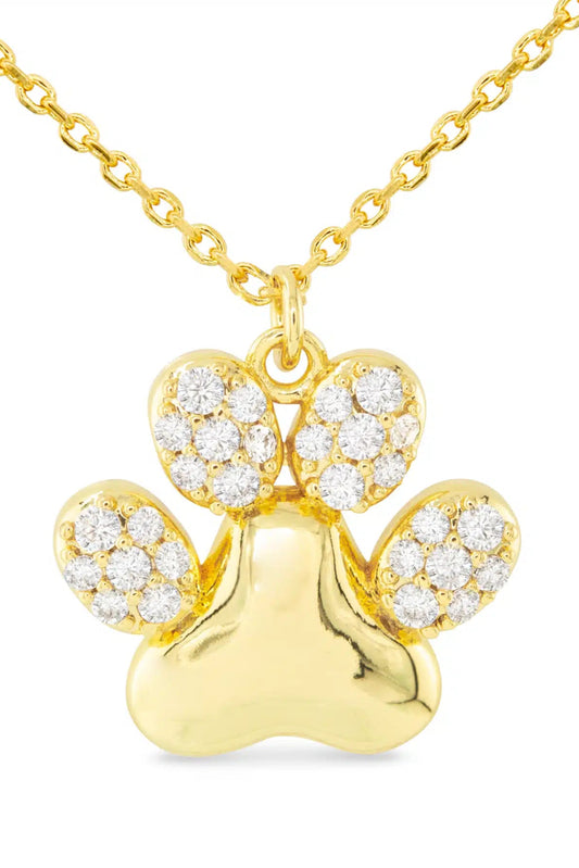 Gold paw print necklace with diamonds on a white background