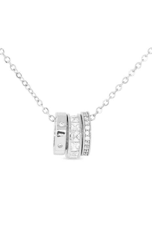 Silver necklace with a circular pendants on a white background