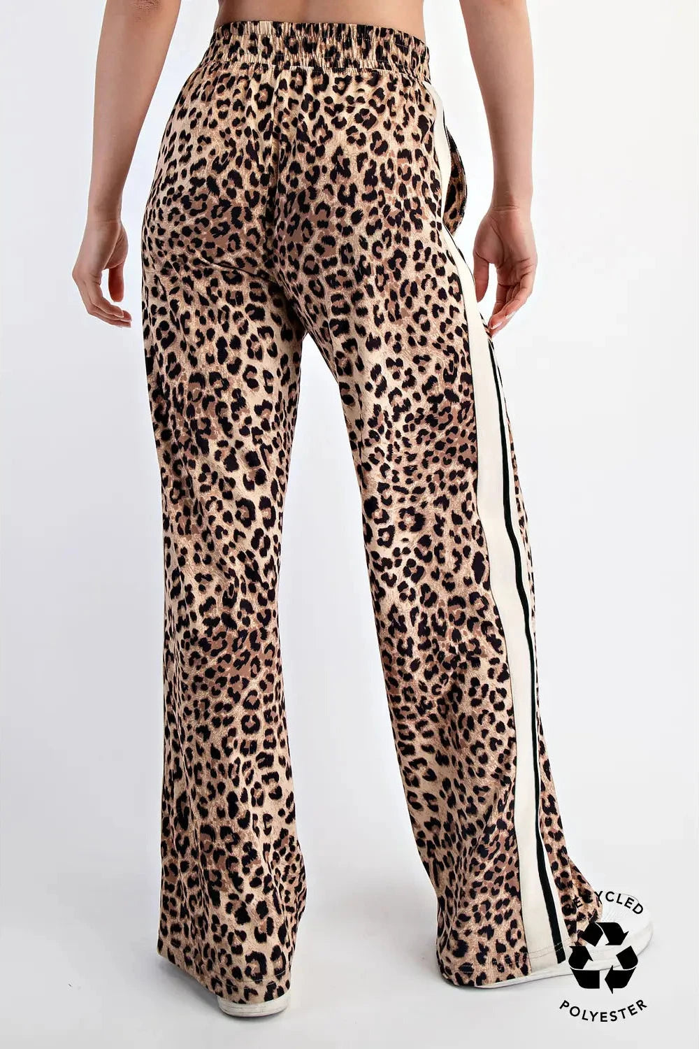 Leopard print pants with a side stripe on a white background