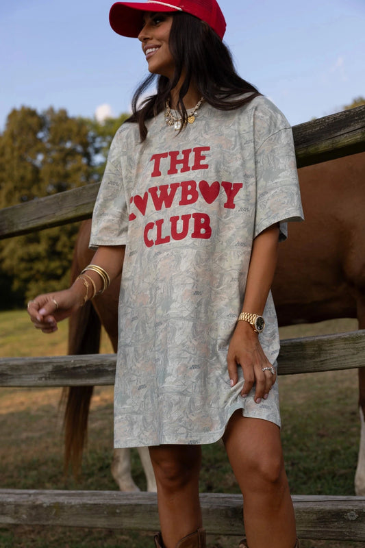 Women wearing a camo dress tee. 