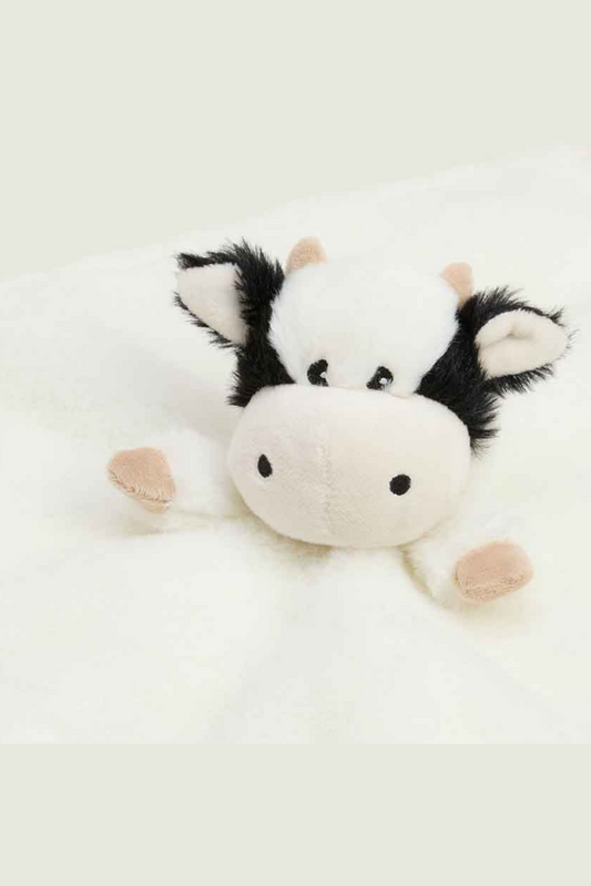 Plush cow toy on a white background