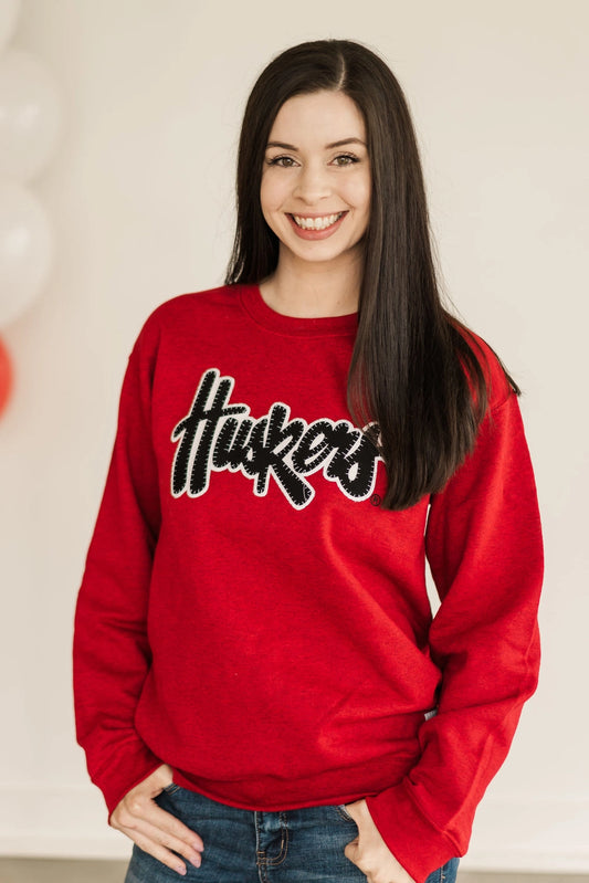 Black Husker Script Red Crewneck