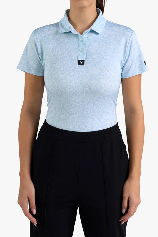 Person wearing a light blue polo shirt with black pants on a white background
