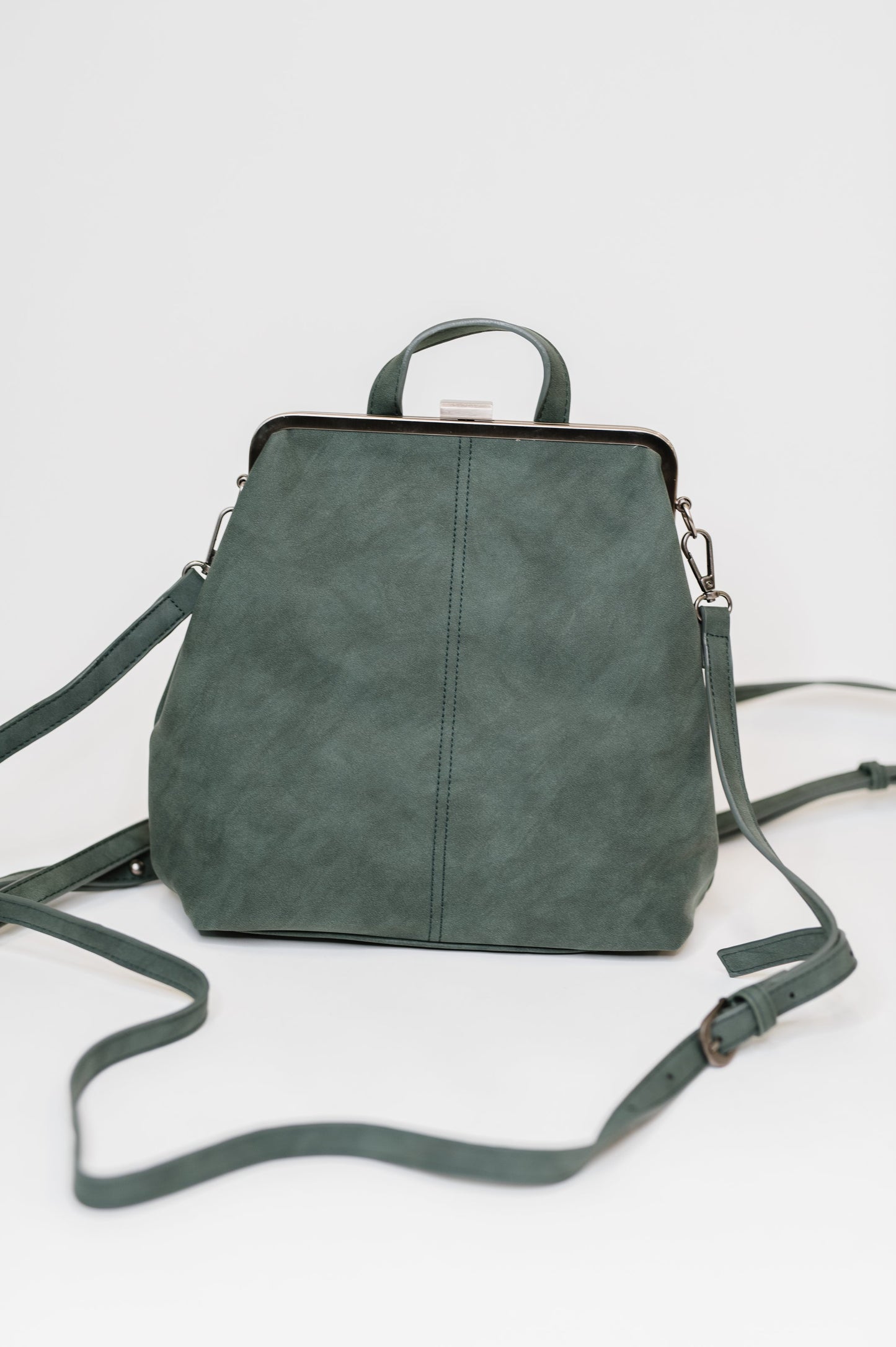 Green backpack on a light gray background