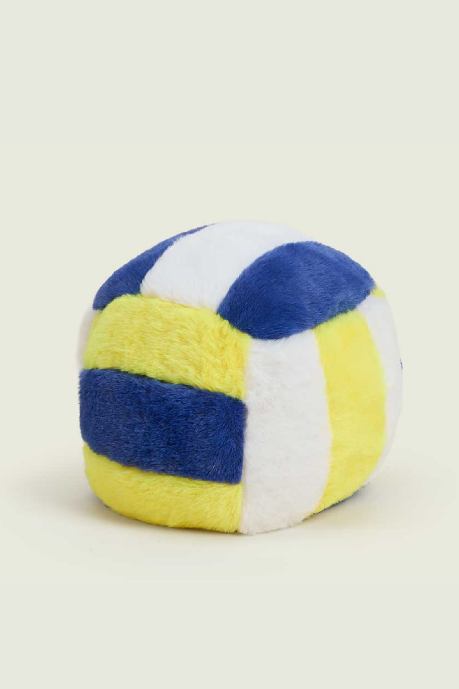 Colorful striped ball on a light beige background