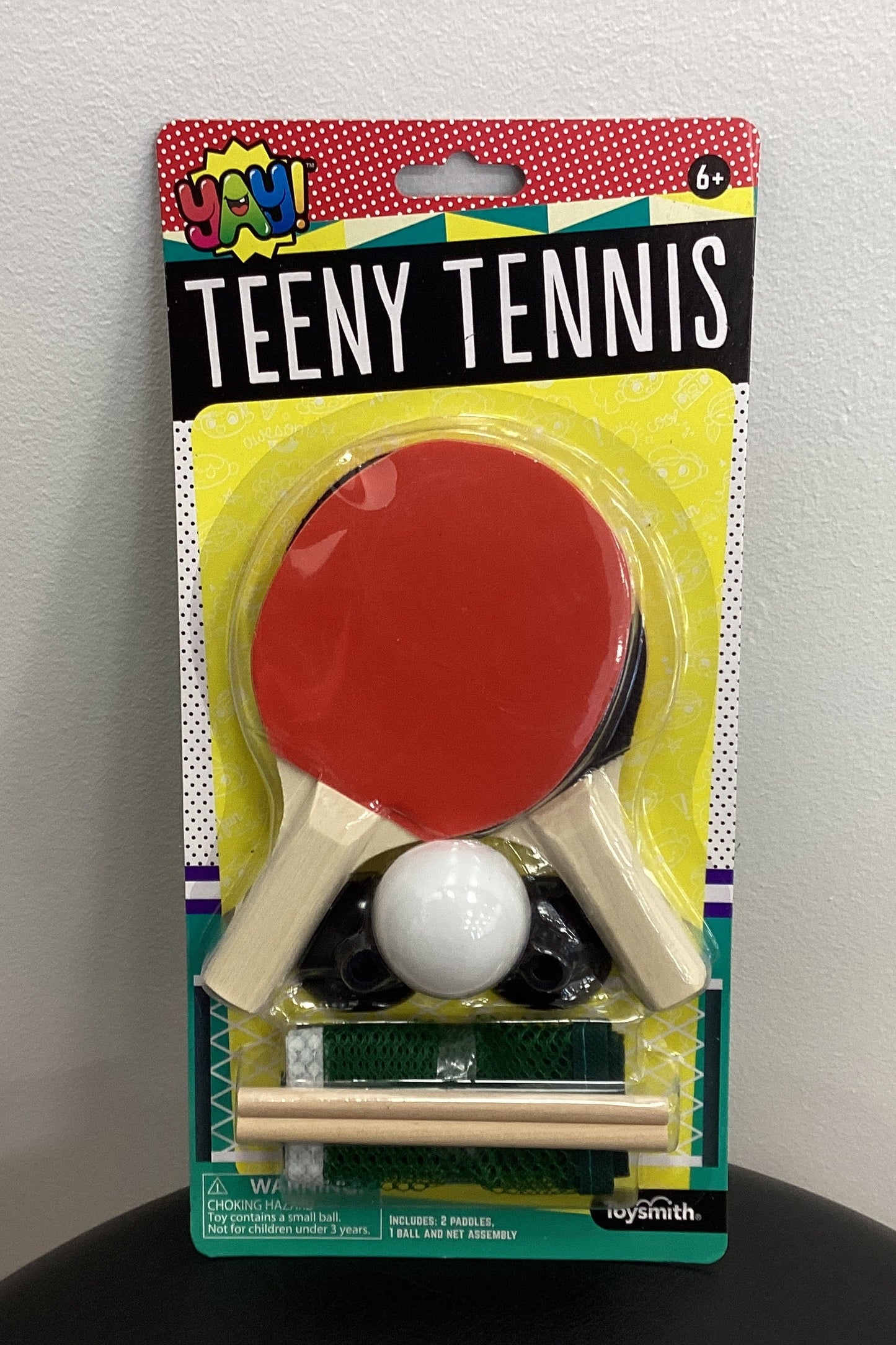 Packaged toy set for teeny tennis on a white background