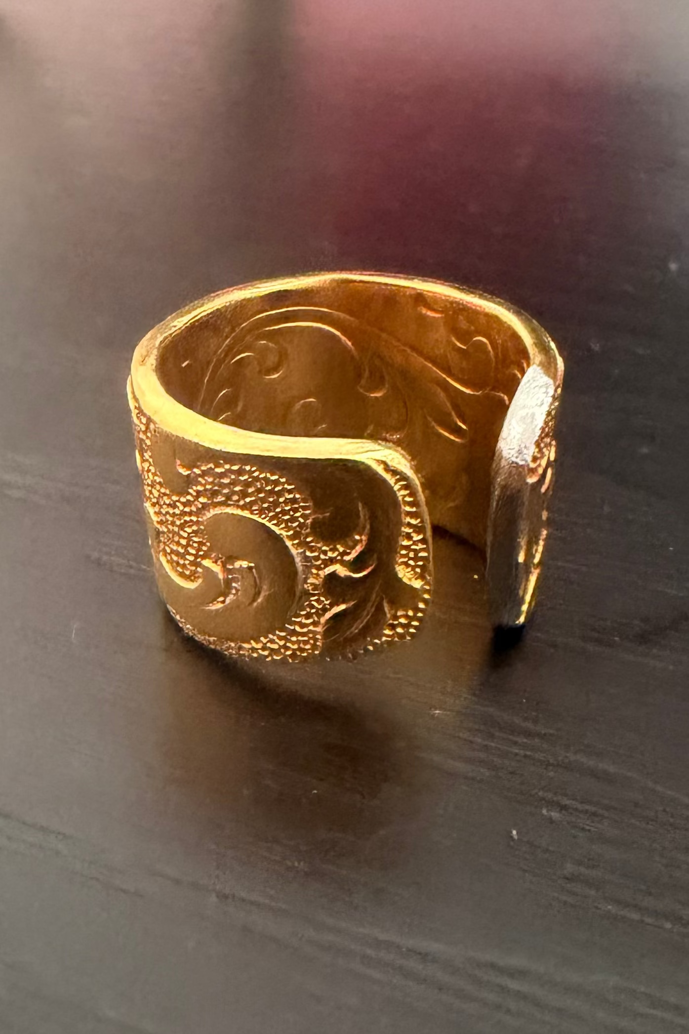 Gold plated ring with scrolling