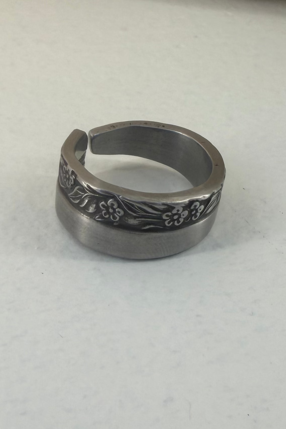 Floral ring shown on white backdrop