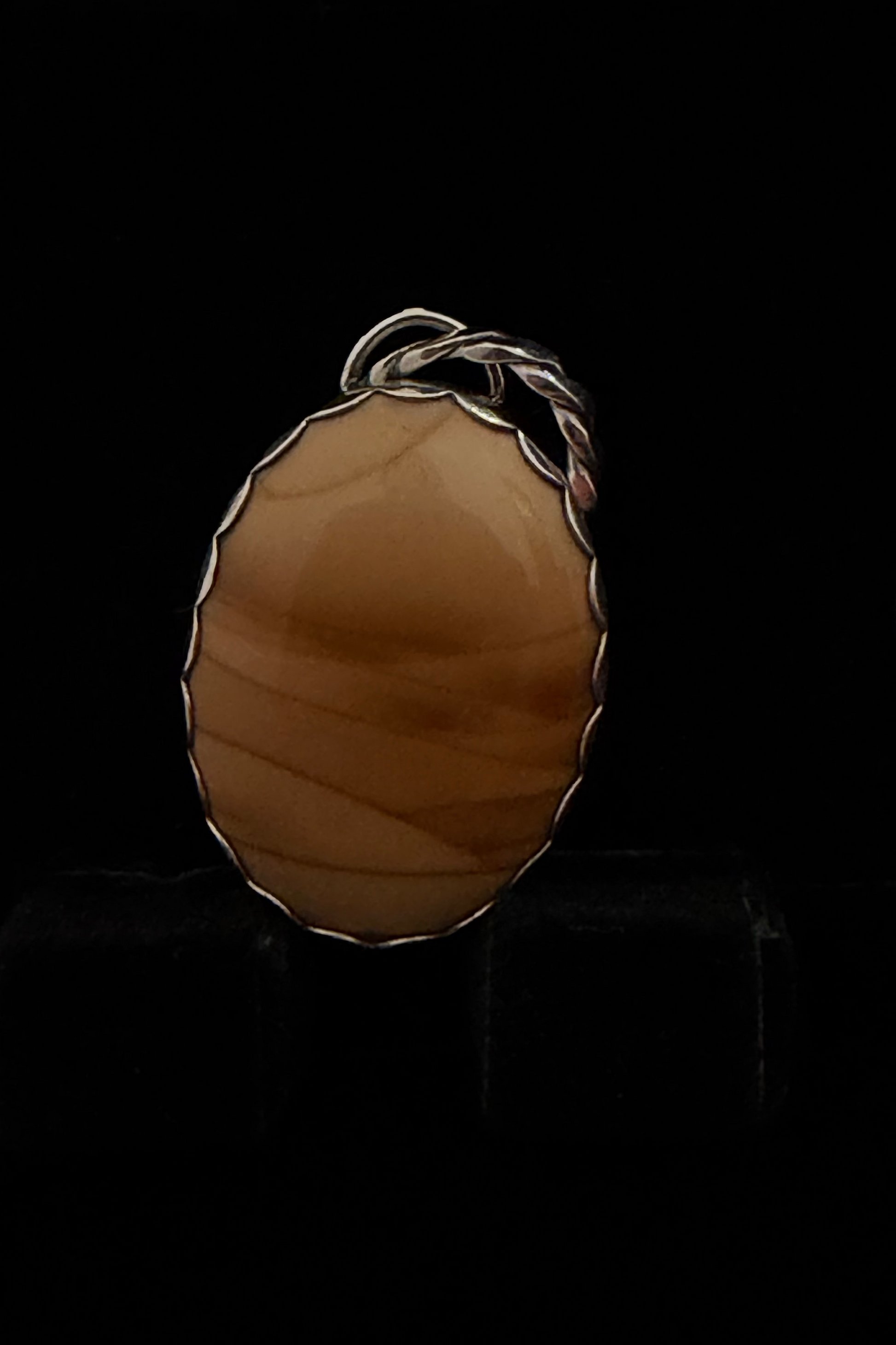 Pendant displayed on a black backdrop