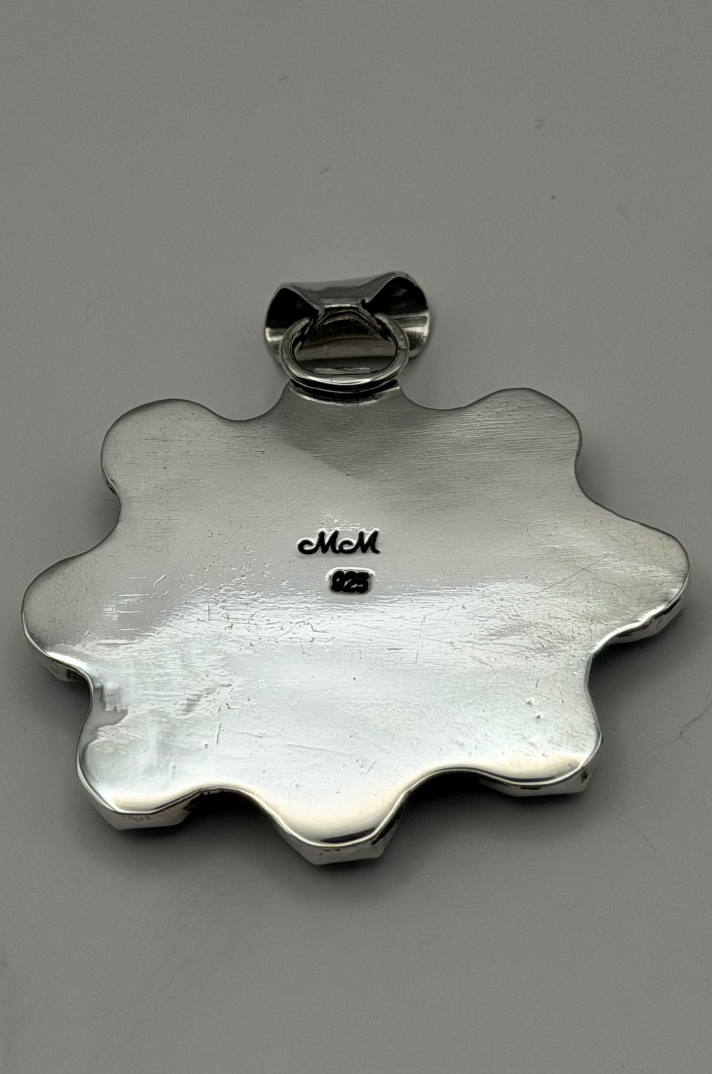 Backside of pendant. Stamped "925"