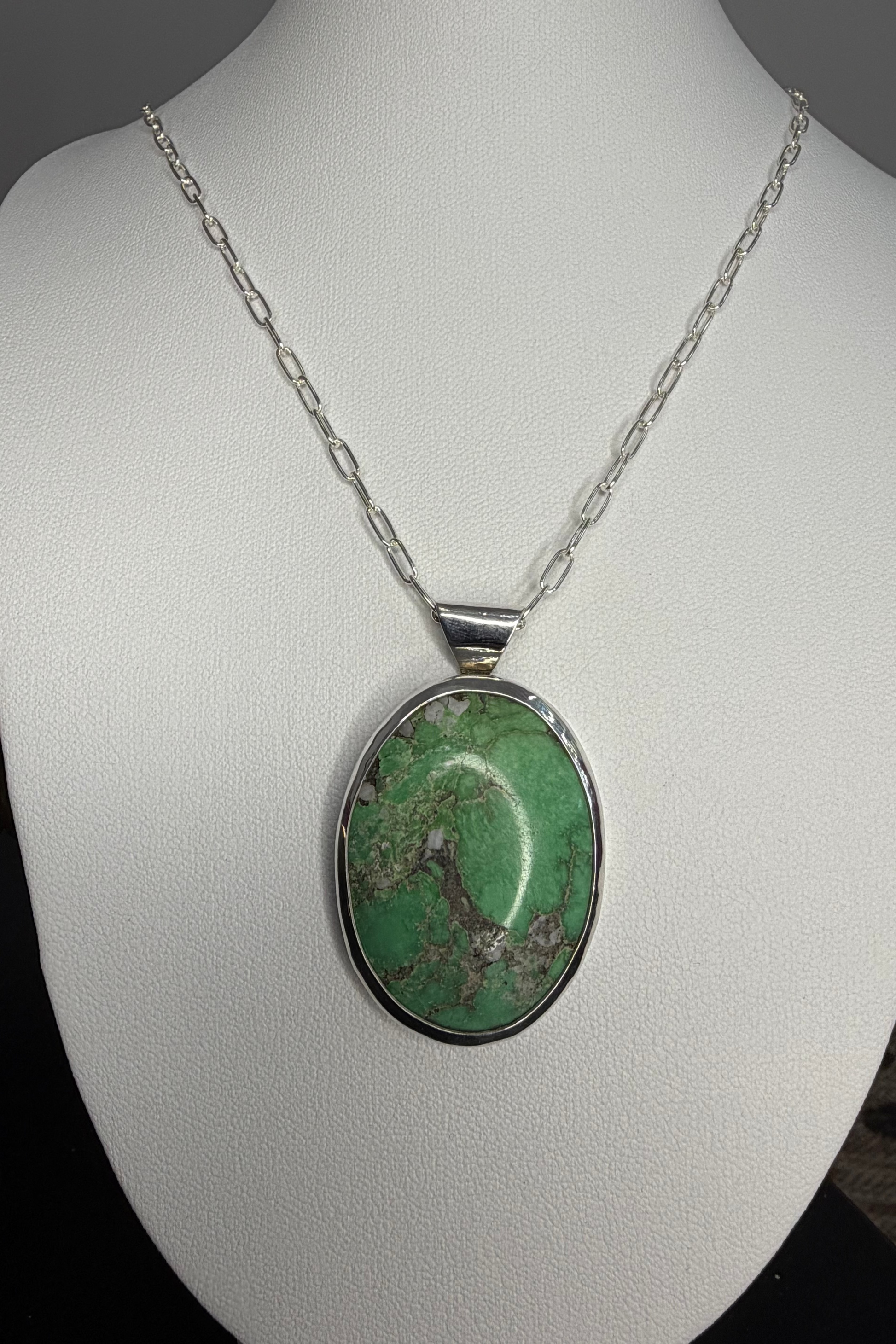 pendant shown on necklace
