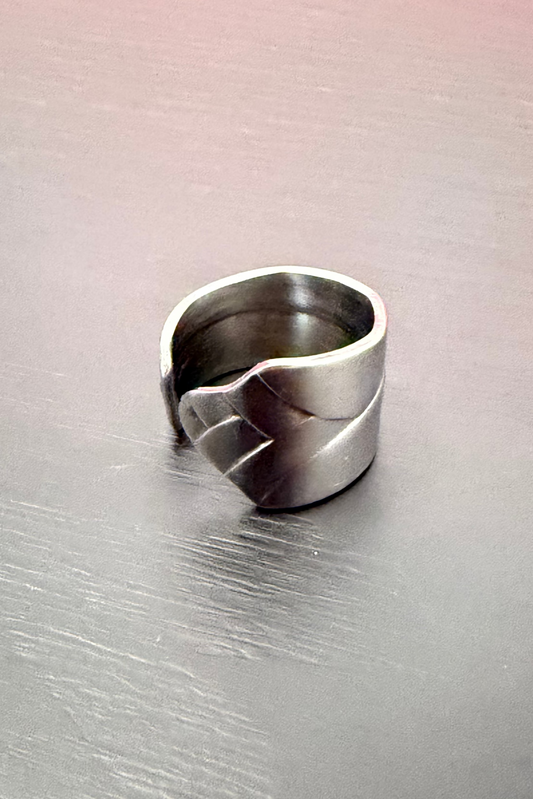 chevron ring on black backdrop
