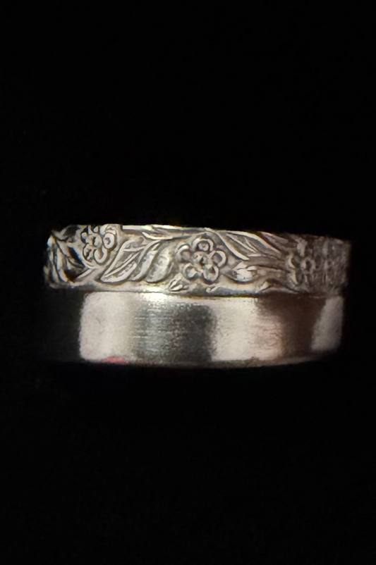 floral ring shown on black backdrop