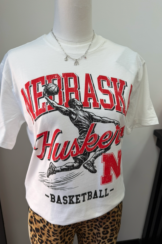 White t-shirt with 'Nebraska Huskers Basketball' print on a mannequin against a neutral background.