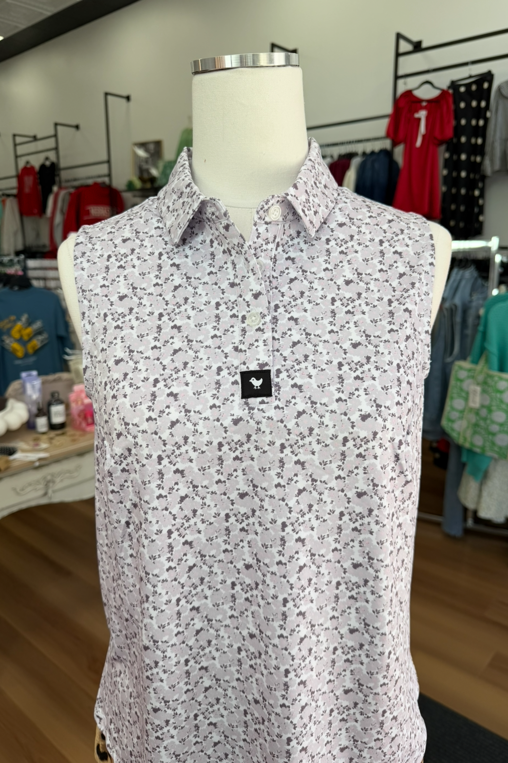 Floral patterned shirt on a mannequin in a clothing store setting