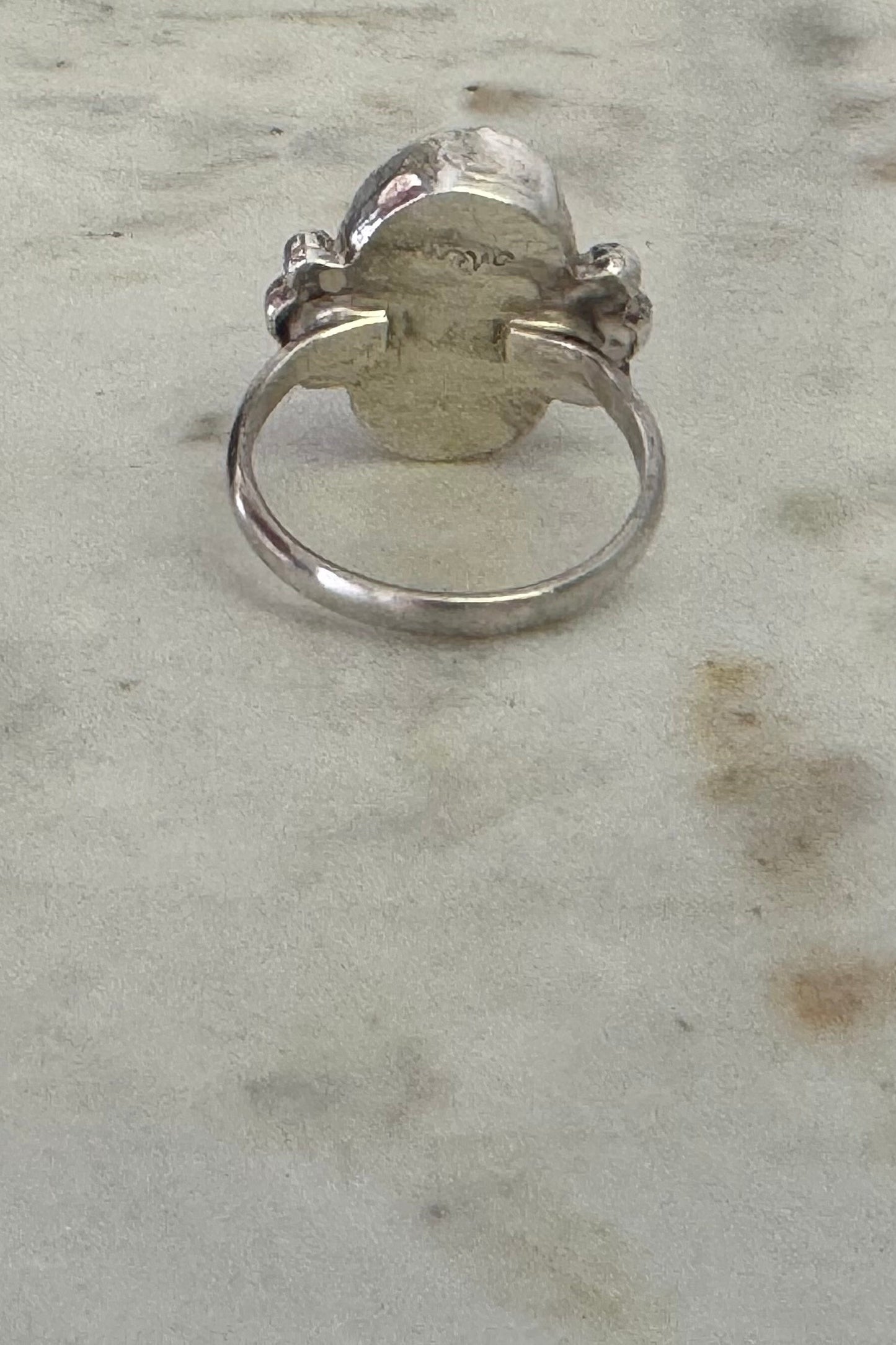 Silver ring on a marble surface