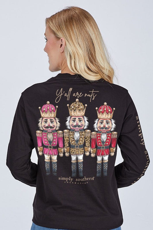 Black long-sleeve shirt with nutcracker design and text on a plain background
