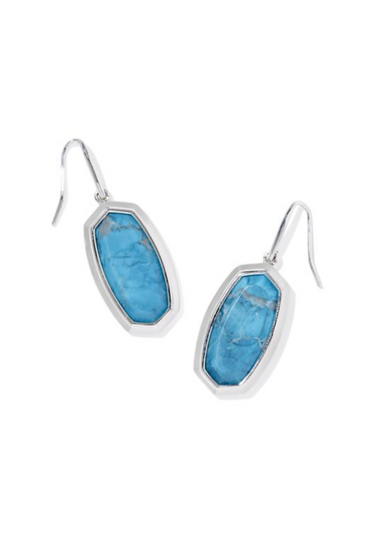 Pair of blue stone earrings on a white background