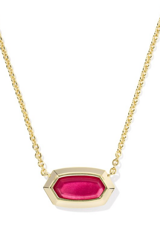 Gold necklace with a red-pink gemstone pendant on a white background