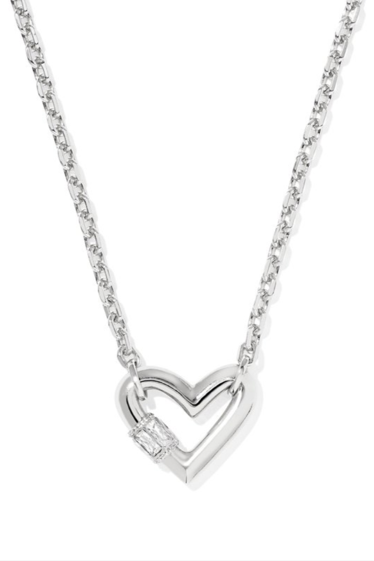 Silver heart-shaped necklace on a white background
