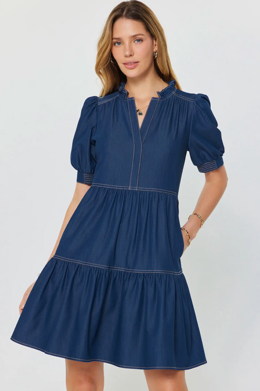 Woman wearing a blue dress on a white background