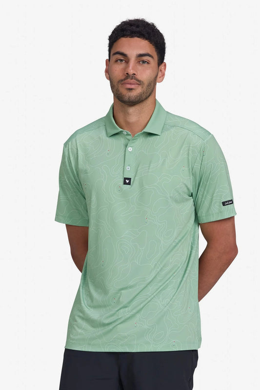 Man wearing a green polo shirt on a white background