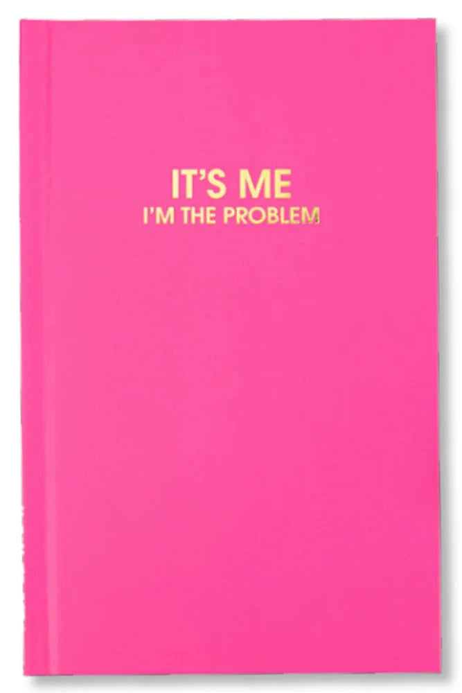 Pink notebook with yellow text 'IT'S ME I'M THE PROBLEM' on a white background