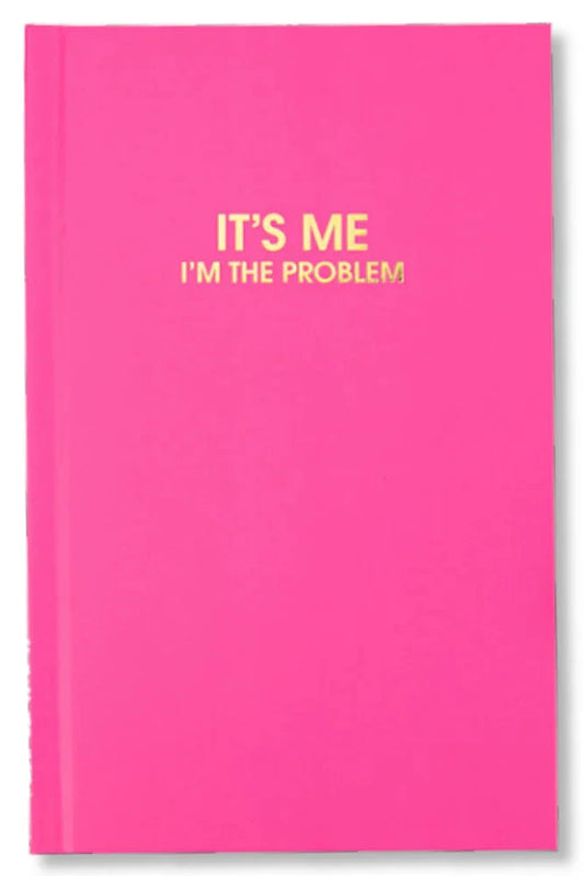 Pink notebook with yellow text 'IT'S ME I'M THE PROBLEM' on a white background