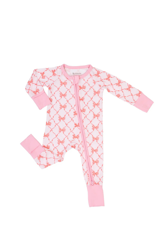 Pink baby onesie with white floral pattern on a white background