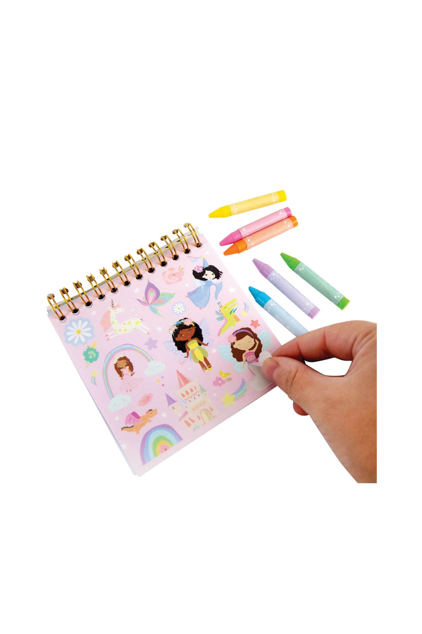 Small notebook with princess designs and colorful crayons on a white background
