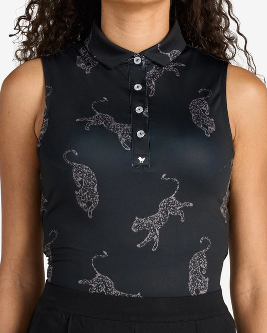 Black sleeveless top with white animal pattern worn by a person