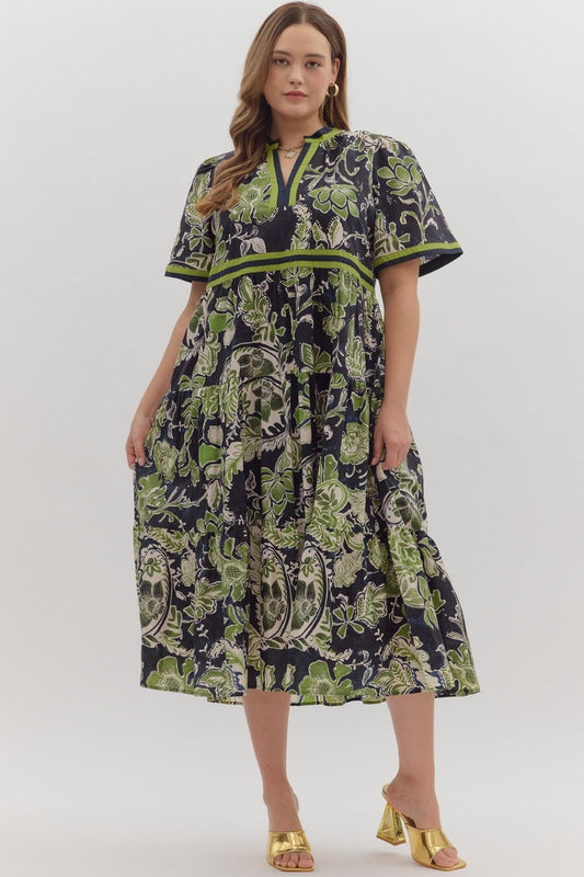 Woman wearing a patterned dress on a white background